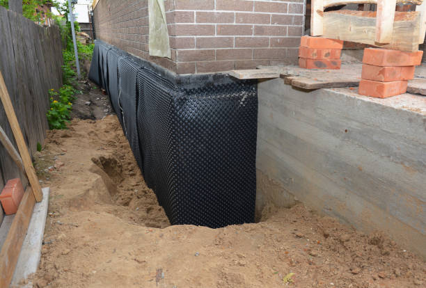 Happy homeowners after waterproofing job in Maybee